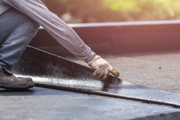 Professional Basement Waterproofing technician working in Amherst, VA